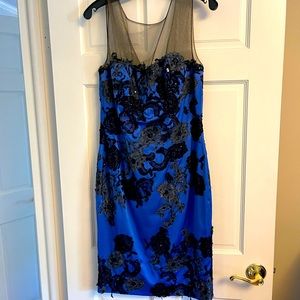 Cocktail dress in blue color top mesh and black flower beading.